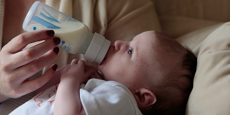 Baby feeding from a bottle