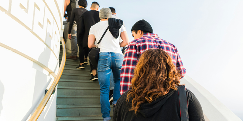 A couple of people waiting in a line