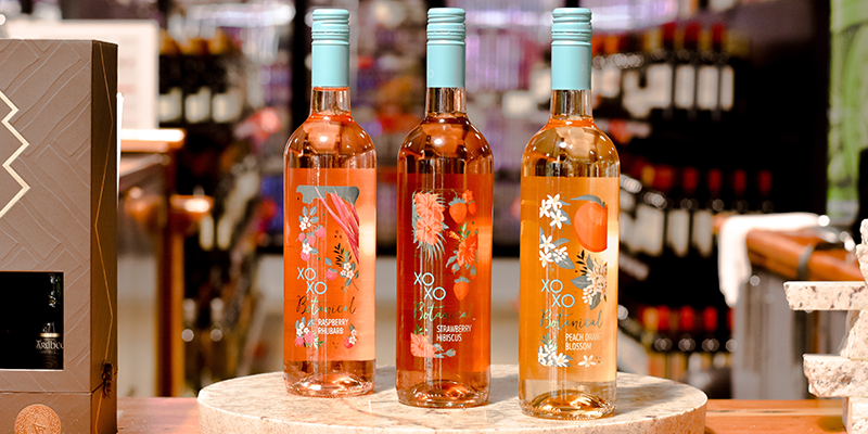 Three wine bottles on a marble plate
