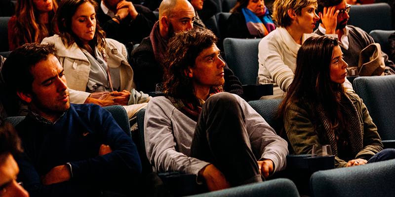 People seated in an auditorium