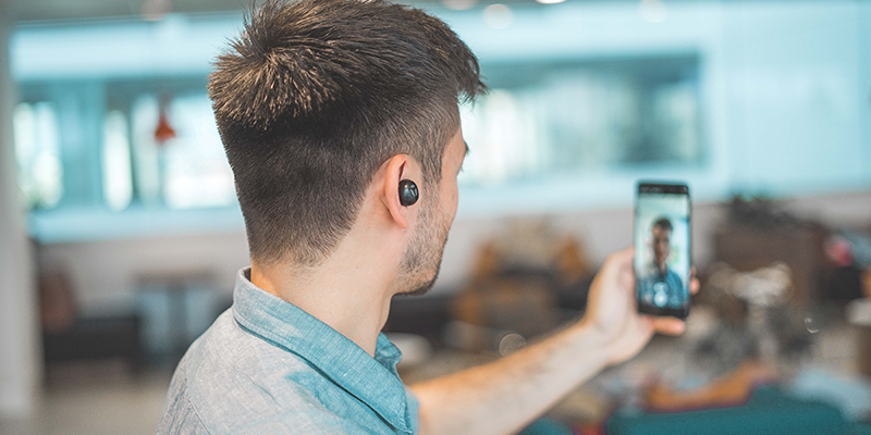 A man recording a selfie video